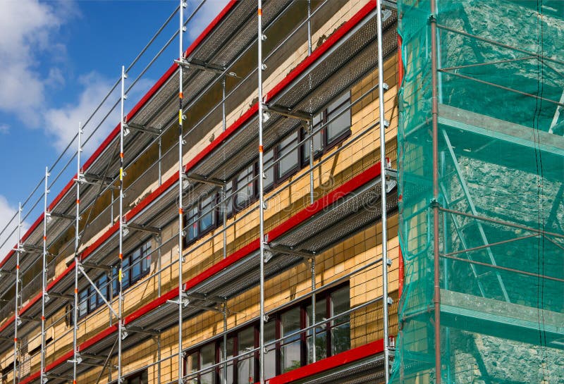Scaffolding for a renovation of an old house royalty free stock photo