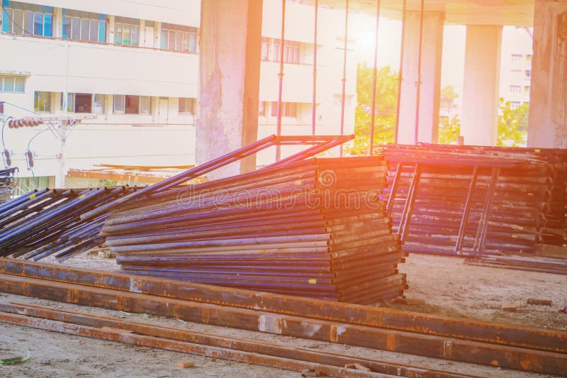 Scaffolding Steel Group in Work Construction Site Building with Sunset