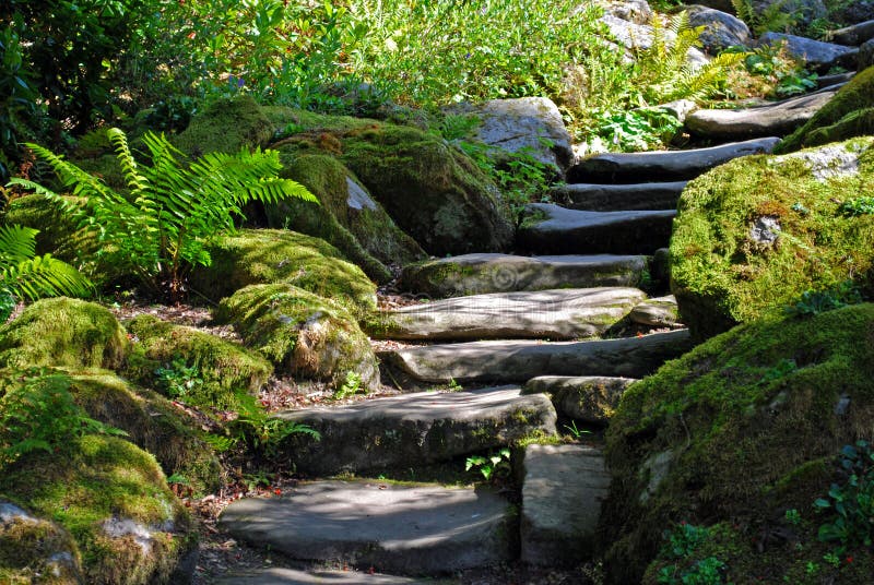 Stairs in a stone garden, surrounded by moss covered rocks and plants. Stairs in a stone garden, surrounded by moss covered rocks and plants