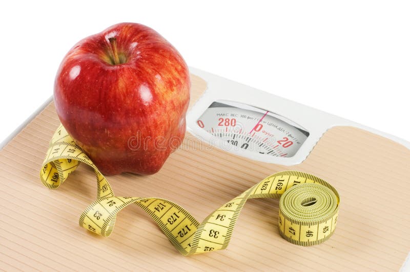 Scale, tape and apple diet concept