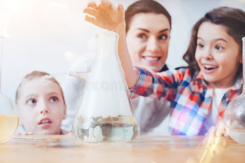 Scaled Up Shot of Children Having Fun in Chemistry Lab Stock Photo
