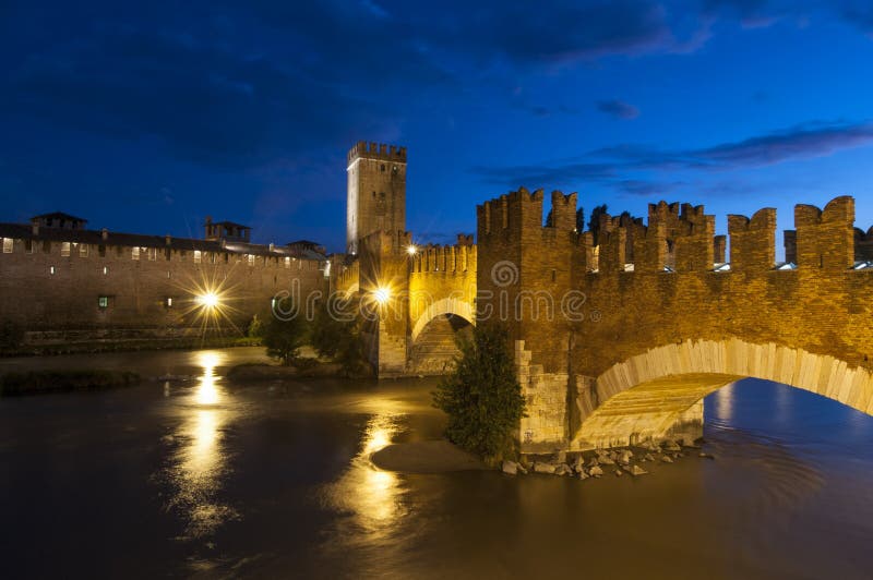Night view of the bridge scaliger or castelvecchio in the middle of a fascinating sky. Night view of the bridge scaliger or castelvecchio in the middle of a fascinating sky