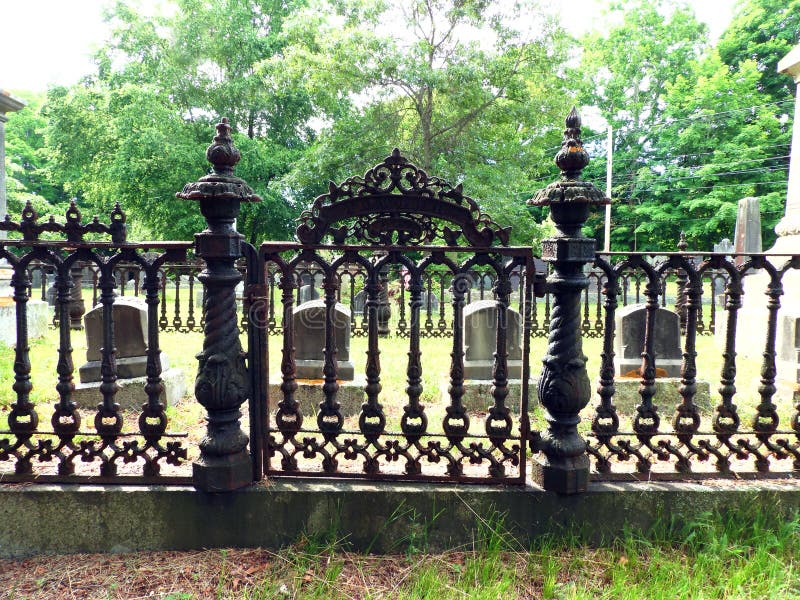 Scalloped picket cast iron gate and fence in cemetery royalty free stock image Scalloped picket cast iron gate and fence in cemetery royalty free stock image