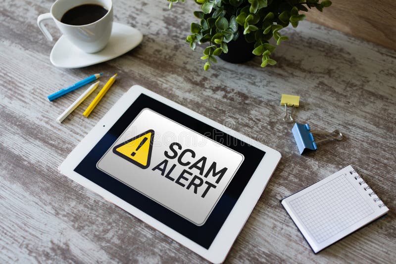 Scam alert detecting warning. Notification on device screen royalty free stock image