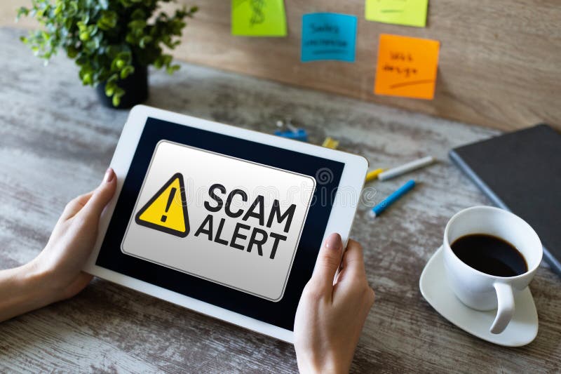 Scam alert detecting warning. Notification on device screen stock images