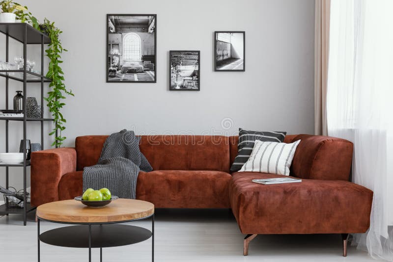 Spacious living room with comfortable brown corner sofa royalty free stock image