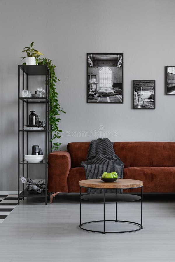 Style in spacious living room with comfortable brown corner sofa royalty free stock images