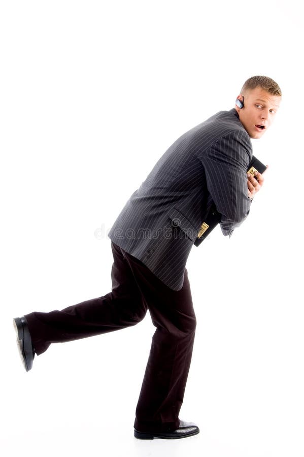 Scared businessman running stock photography