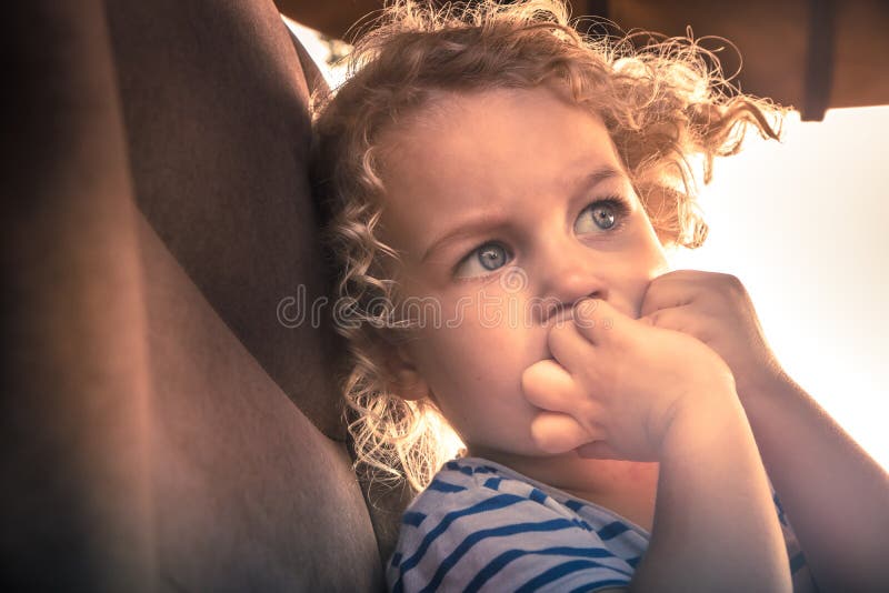 Scared child worry emotion portrait facial expression symbolizing worry and scare expression on child face.