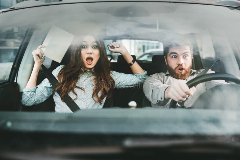 scared-couple-car-front-portrait-9879805