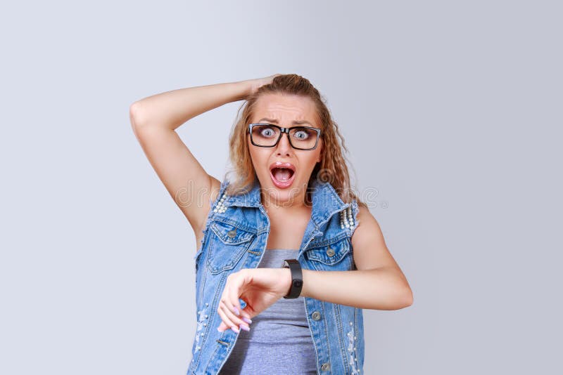 Scared hurrying woman looking at time stock photos Scared hurrying woman looking at time stock photos