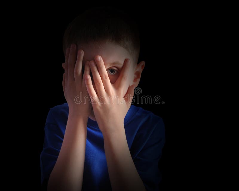 Scared Little Child Covering Eyes on Black royalty free stock photos Scared Little Child Covering Eyes on Black royalty free stock photos