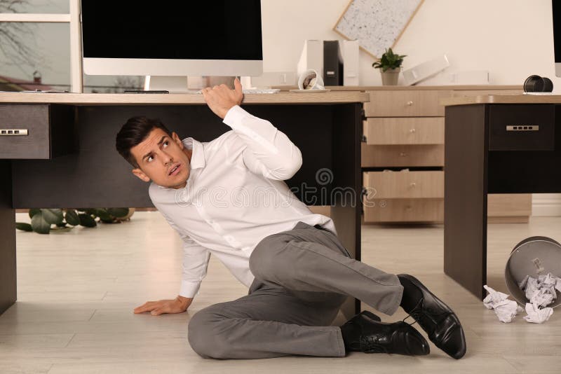 183 Man Office Hiding Under Desk Stock Photos Free & RoyaltyFree