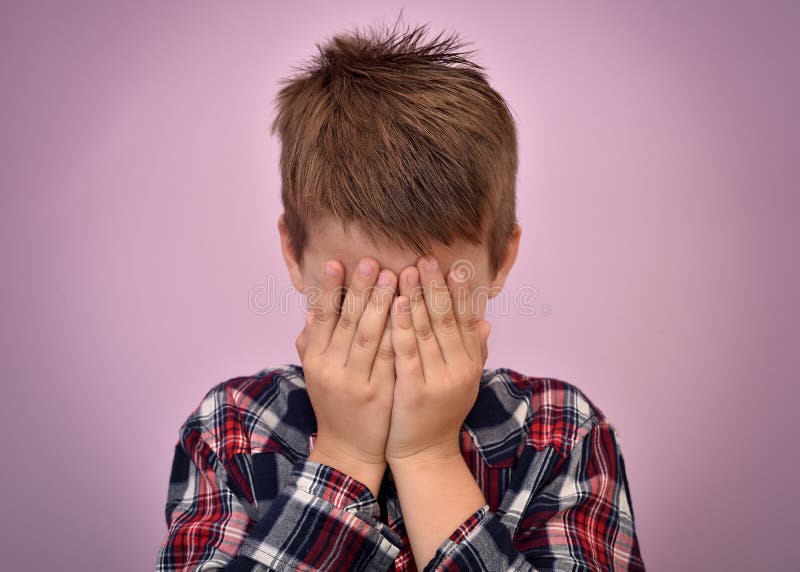 Scared Young Boy with Hands on His Face Stock Photo - Image of