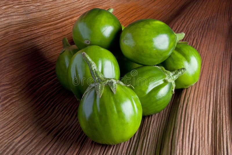 Premium Photo  Scarlet eggplant on a wooden board and wooden background