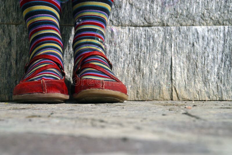 Close up of colored socks and red shoes. Close up of colored socks and red shoes