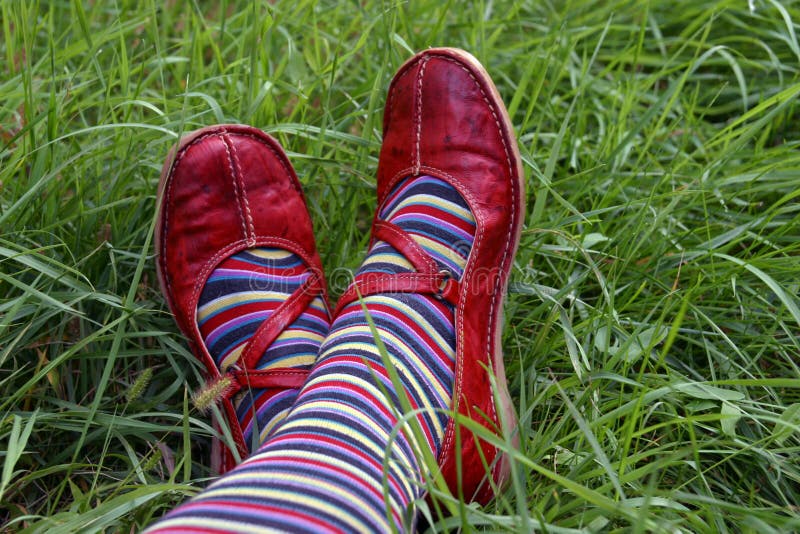 Close up of colored socks and red shoes. Close up of colored socks and red shoes