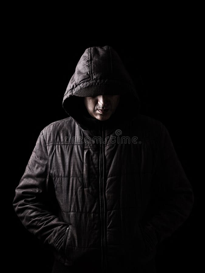 Scary and creepy caucasian or white man hiding in the shadows stock images Scary and creepy caucasian or white man hiding in the shadows stock images