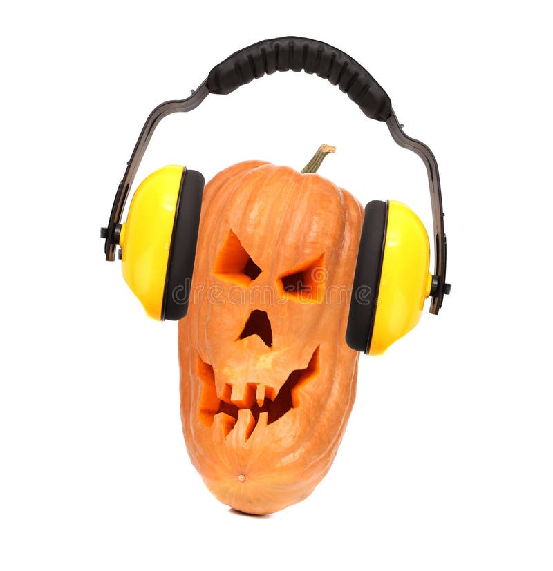 Scary evil face of pumpkin with headphones. royalty free stock photography Scary evil face of pumpkin with headphones. royalty free stock photography