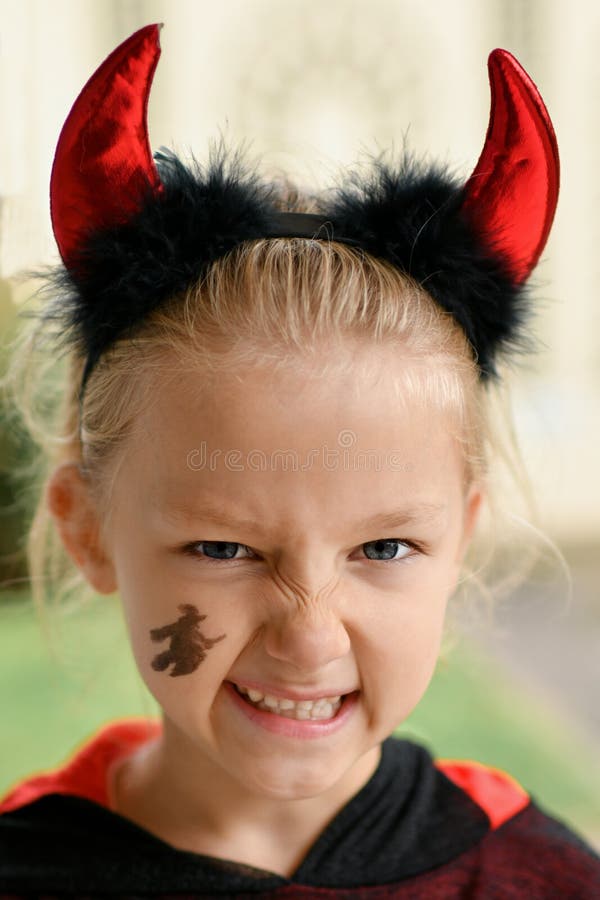 A Girl Dressed As a Devil with Horns Stock Image Image of lifestyle, little 233390497