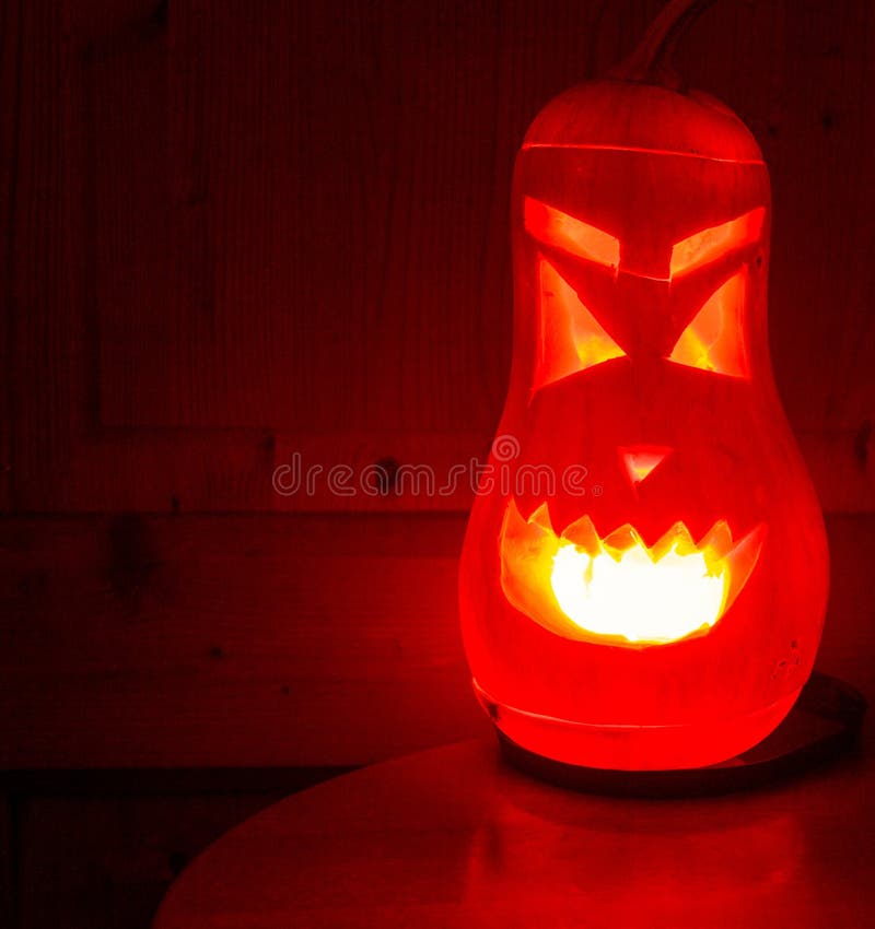 Scary Halloween Pumpkin with Burning Smile and Eyes in the Dark Stock