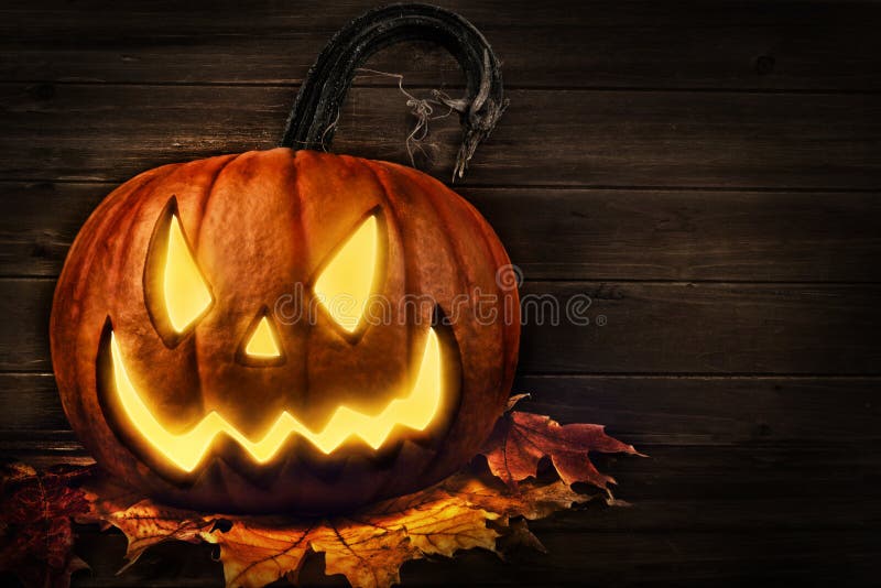 Scary horror background with Halloween pumpkin jack o lantern.