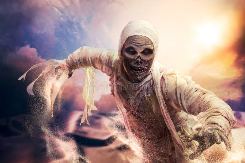 Scary mummy in a desert at sunset stock images Scary mummy in a desert at sunset stock images