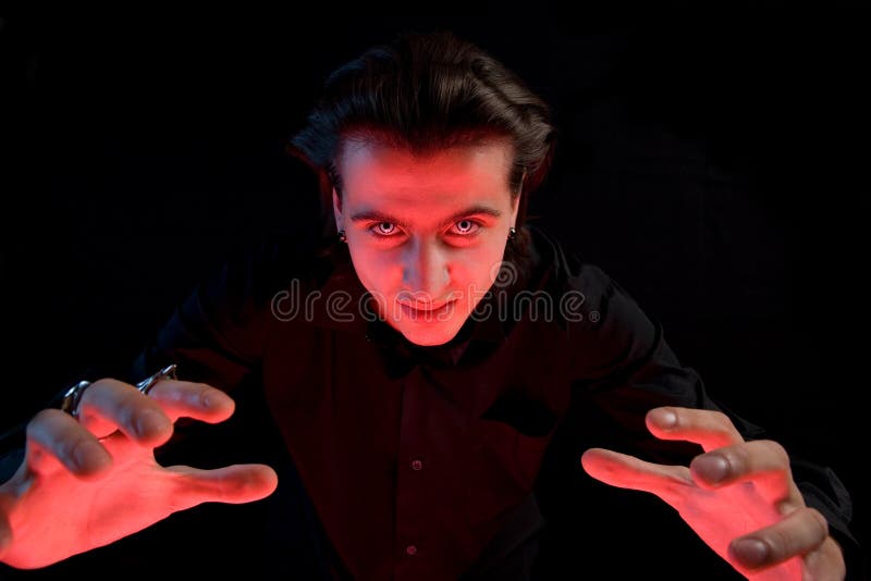 Scary vampire stretching his hands stock photography