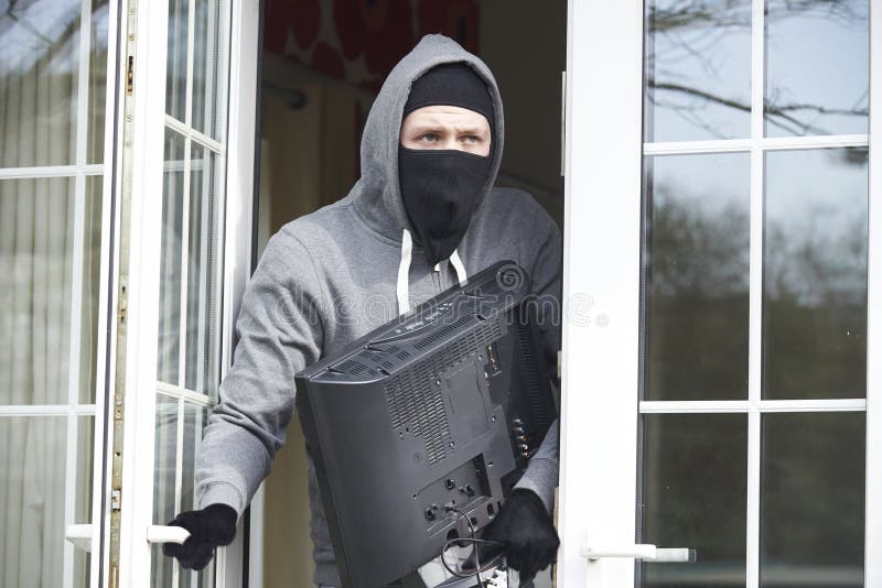 Burglar Breaking Into House And Stealing TV. Burglar Breaking Into House And Stealing TV