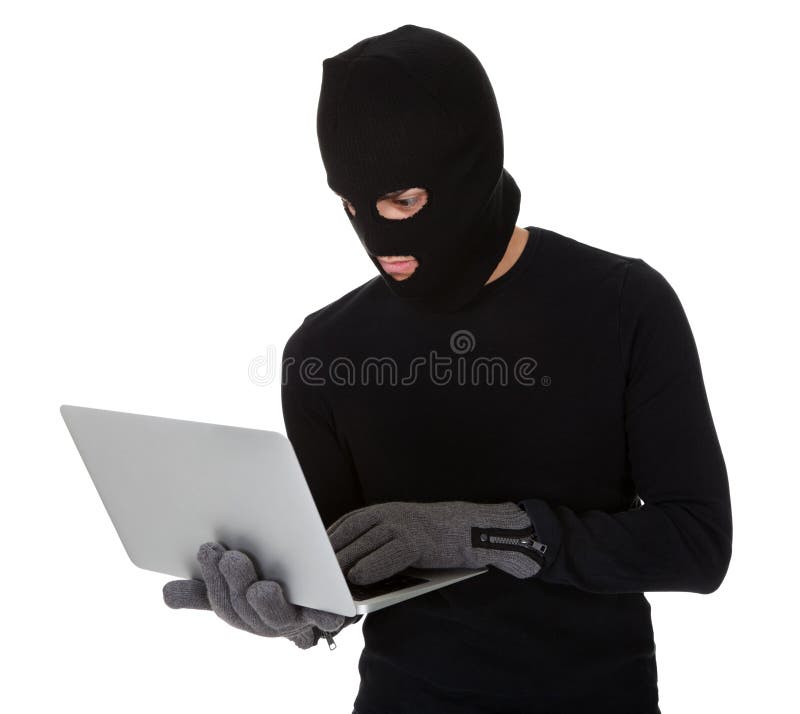 Thief in disguise stealing data from computer. Thief in disguise stealing data from computer