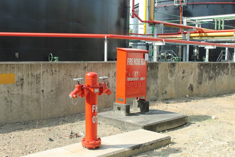 Outdoor Hydrant & Fire Hose Box at Oil & Gas Plant. Outdoor Hydrant & Fire Hose Box at Oil & Gas Plant