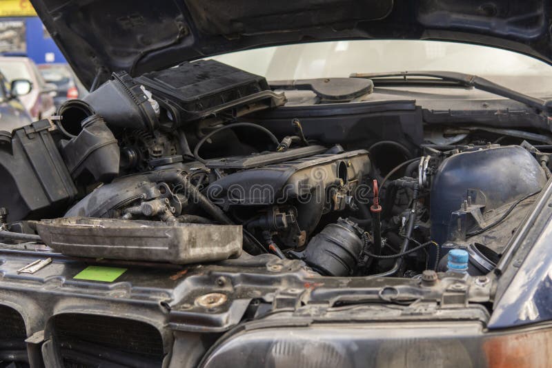 Scatter Old Car Parts in the Engine Compartment after Engine Repair