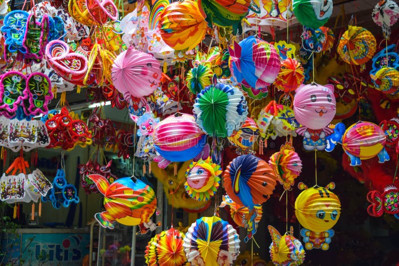 Colorful scene, friendly vendor on Hang Ma lantern street, lantern at open air market, traditional culture on mid autumn, Vietnam, August 30, 2015. Colorful scene, friendly vendor on Hang Ma lantern street, lantern at open air market, traditional culture on mid autumn, Vietnam, August 30, 2015