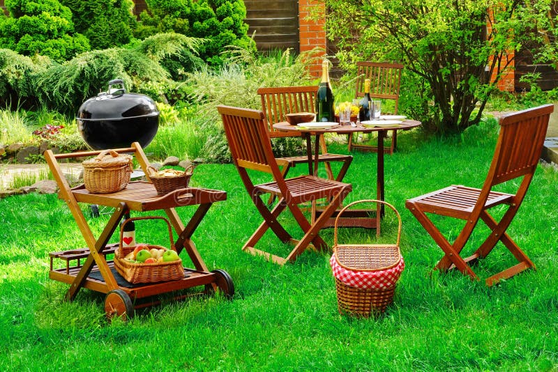 Scene Of Barbecue Grill Party On Lawn In The Backyard stock photo Scene Of Barbecue Grill Party On Lawn In The Backyard stock photo