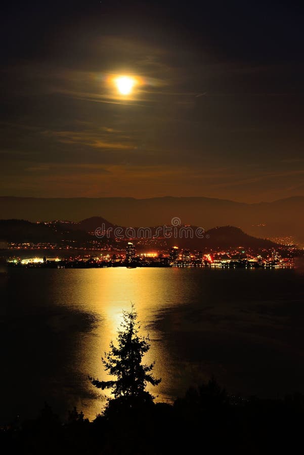 Scene of Misty Full Moon Over Kelowna BC Canada Stock Photo Image of