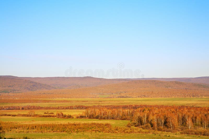 Scenic autumn landscape. meadow, forest and mountains royalty free stock photos Scenic autumn landscape. meadow, forest and mountains royalty free stock photos