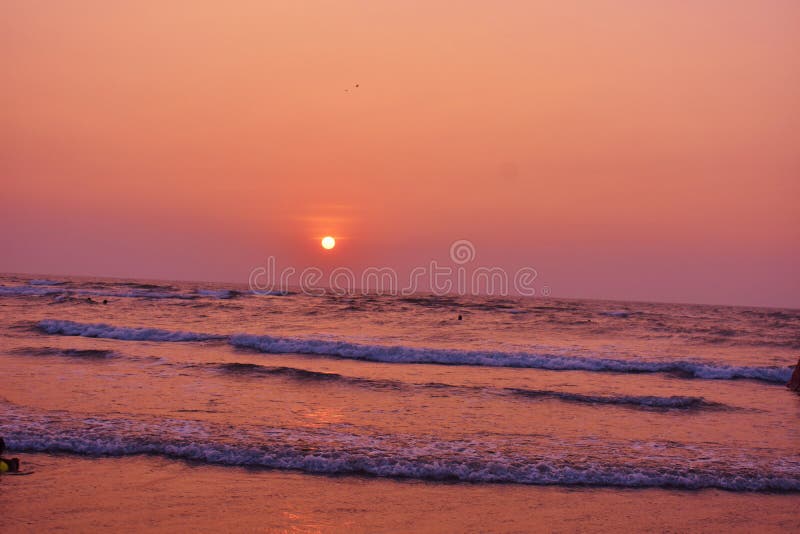 Sunset with sea water at Morjim Beach, Goa stock images Sunset with sea water at Morjim Beach, Goa stock images