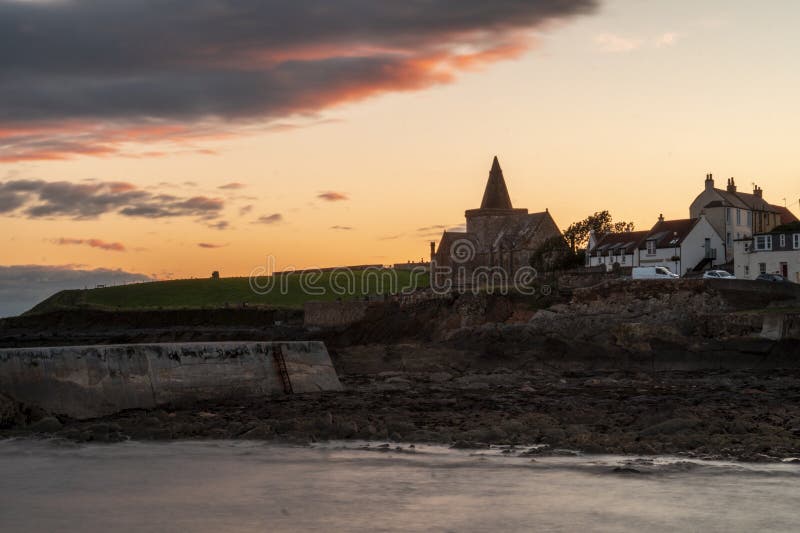 Scenic sunset over coastal town and waterway stock photography