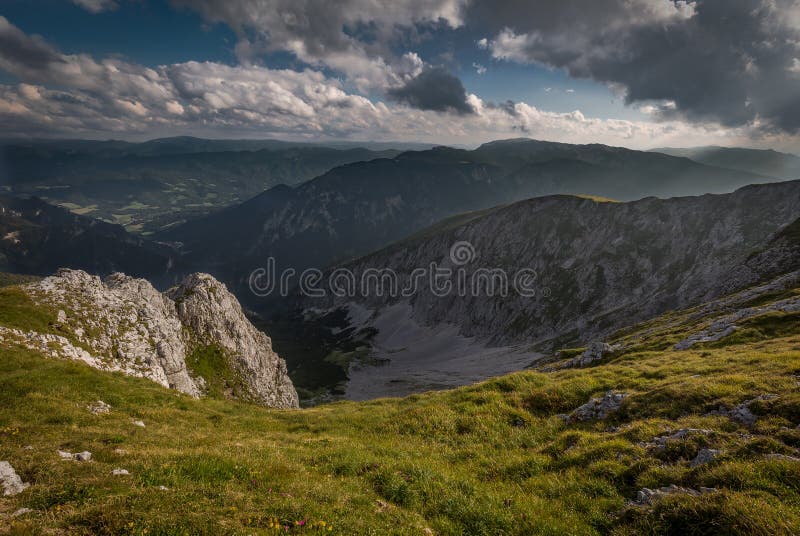 Scenic sunset view from Dambocksteig trek on valley of Rax plateau with idyllic, fresh, green, grassy meadow stock photo Scenic sunset view from Dambocksteig trek on valley of Rax plateau with idyllic, fresh, green, grassy meadow stock photo