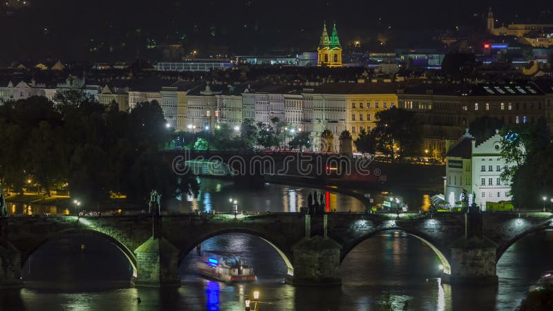 Scenic view of bridges on the Vltava river night timelapse and of the historical center of Prague: buildings stock video footage Scenic view of bridges on the Vltava river night timelapse and of the historical center of Prague: buildings stock video footage