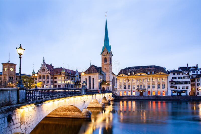 scenic view of historic Zurich city center with famous Fraumunster and Grossmunster Churches and river Limmat at Lake Zurich