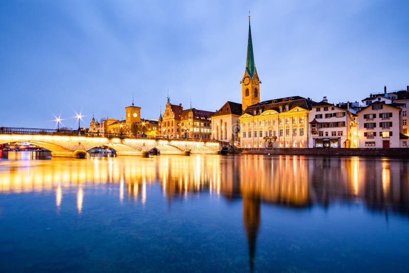 scenic view of historic Zurich city center with famous Fraumunster and Grossmunster Churches and river Limmat at Lake Zurich