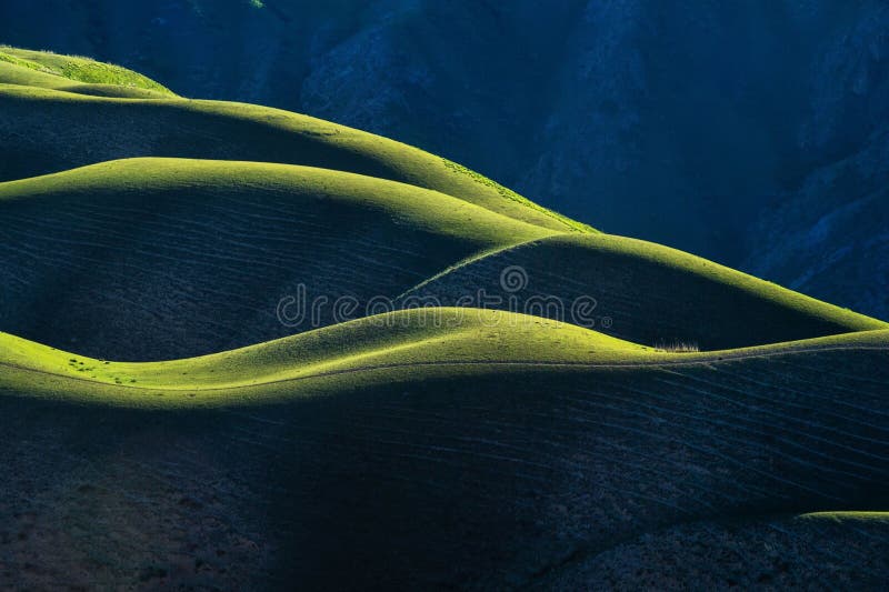 Scenic view of Karajun Grassland under dramatic lighting create a wave-like pattern in the landscape vector illustration