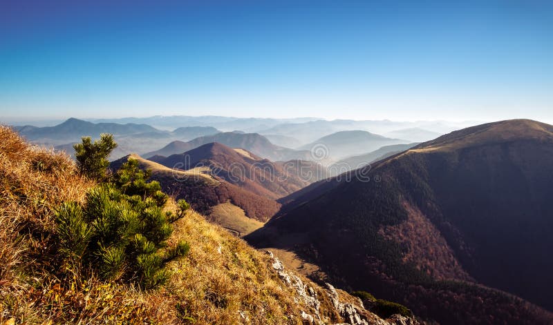 Scenic view of misty mountain hills in fall, Slovakia