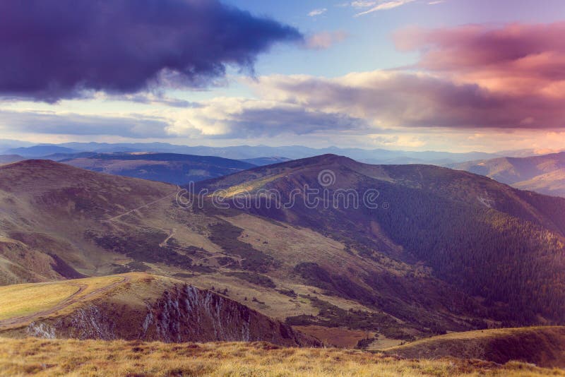 Scenic view of mountains with colorful hills at sunset. stock photography Scenic view of mountains with colorful hills at sunset. stock photography