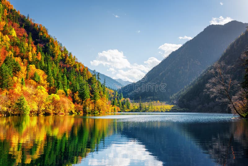 Scenic view of the Panda Lake. Autumn woods reflected in water