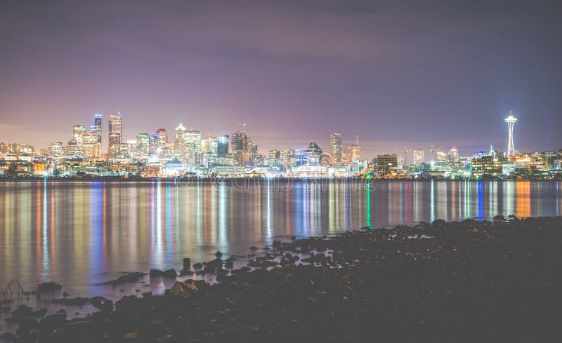 Scenic view of Seattle city in the night time with reflection in water.