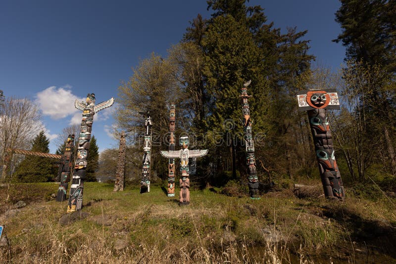 Scenic view of the Totem Poles site with a collection of nine totem poles in Stanley Park, Vancouver stock image
