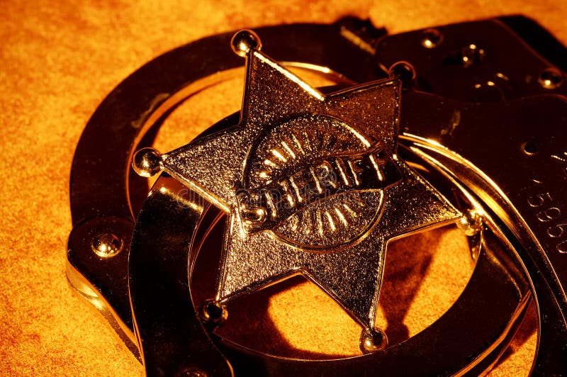 Sheriffs Badge and Handcuffs. Sheriffs Badge and Handcuffs