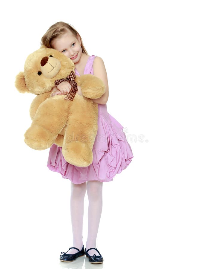 Sch?nes kleines M?dchen 5-6 Jahre Sie h?lt ein gro?es Teddyb?r bea lizenzfreies stockfoto Sch?nes kleines M?dchen 5-6 Jahre Sie h?lt ein gro?es Teddyb?r bea lizenzfreies stockfoto